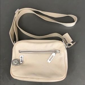 Michael Kors cream travel purse